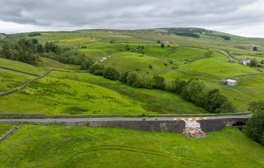 drone shot of collapsed wall