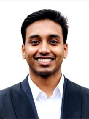 A portrait of Shihas Melikkattil Shamsudheen wearing a navy suit
